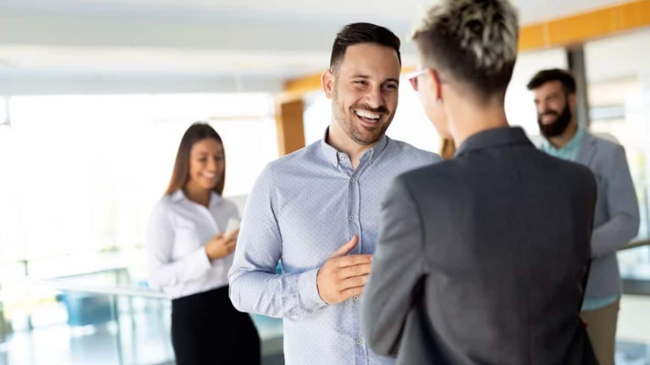 Man speaking confidently during a meeting or social setting