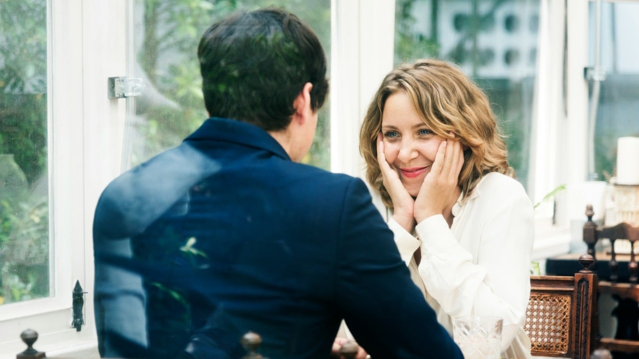 A couple dating in a cafe.