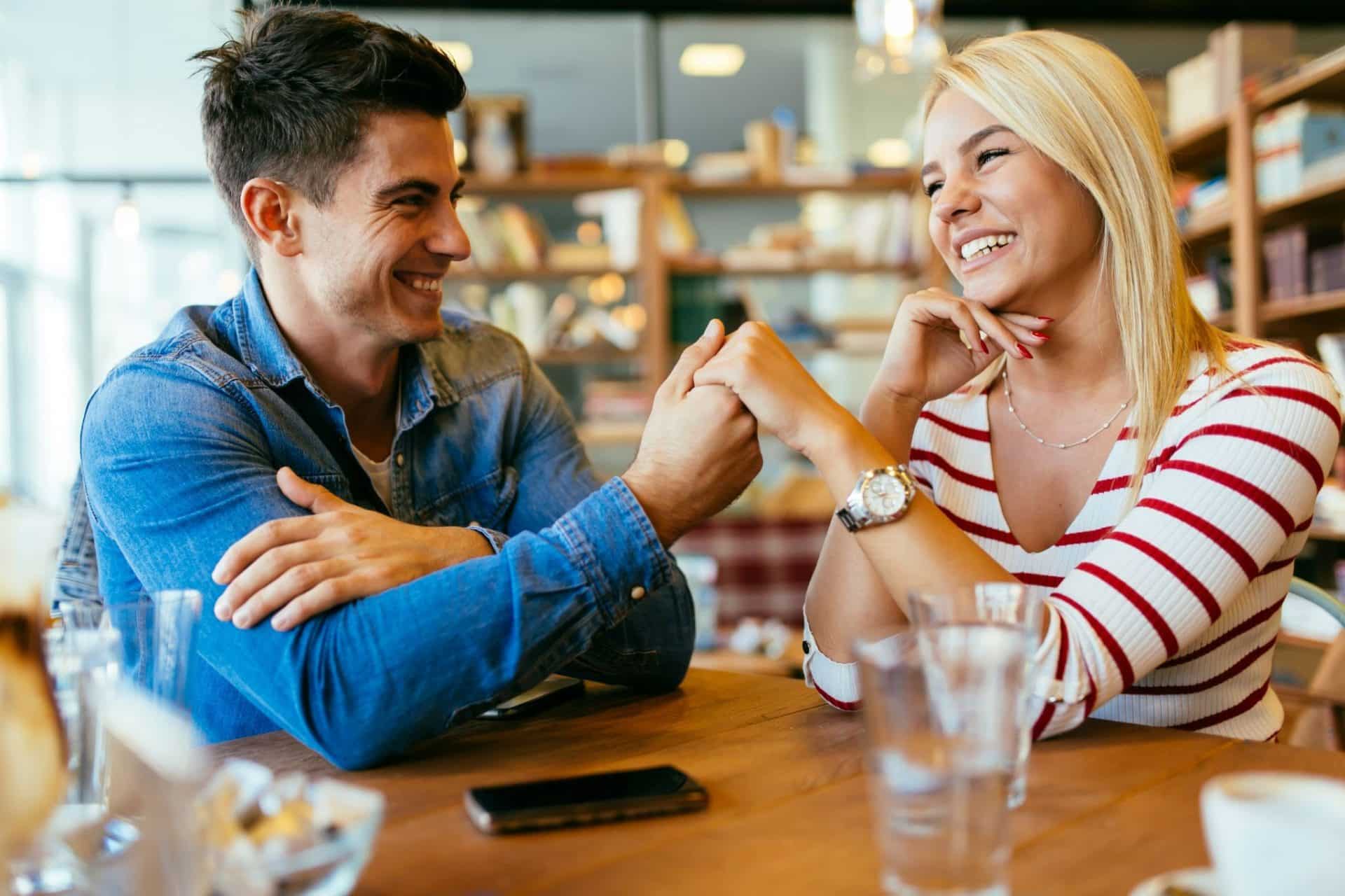 A man holding the hand of a woman