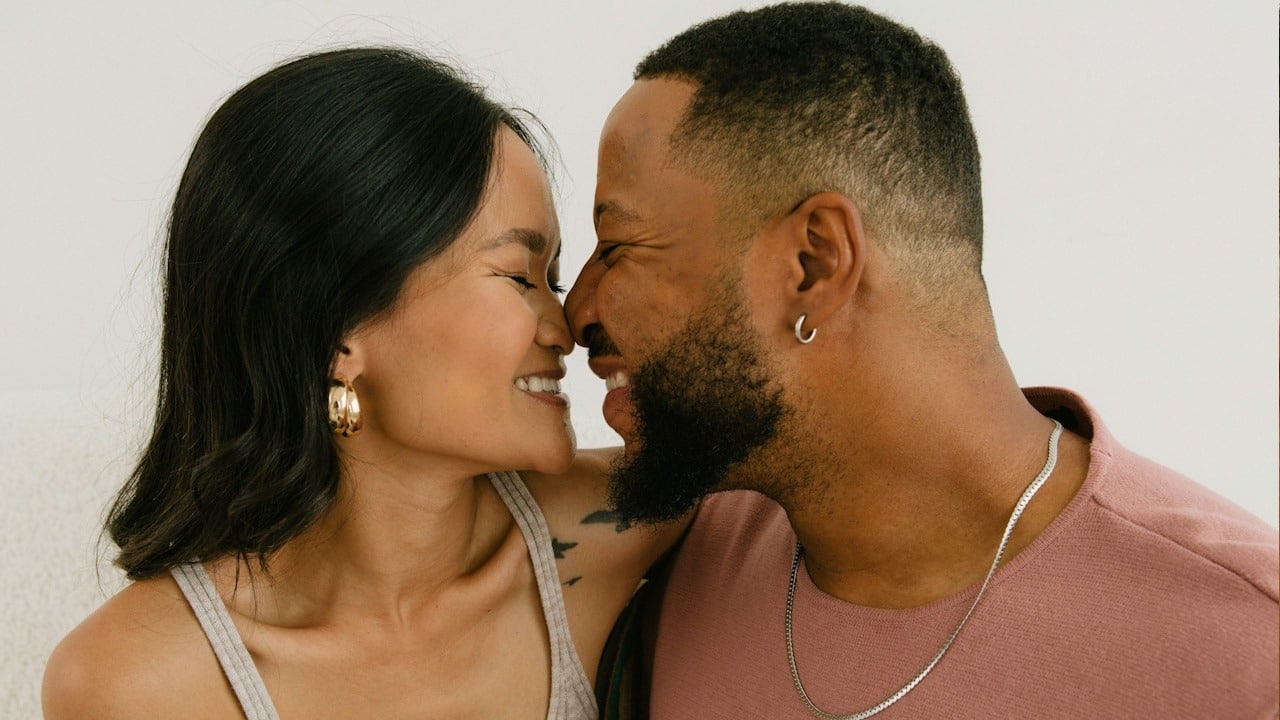 A couple touching their noses.