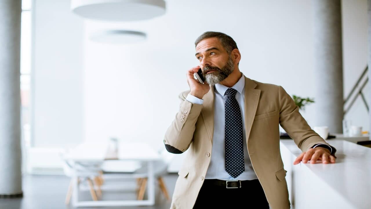 A stylish man on the phone