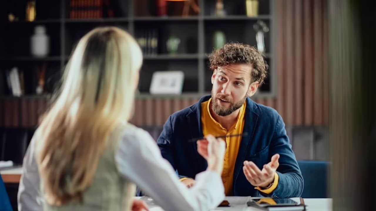 Couple having a serious but calm conversation at home