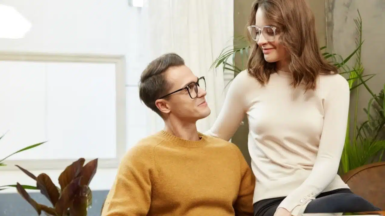 A man and woman having an honest conversation on the couch