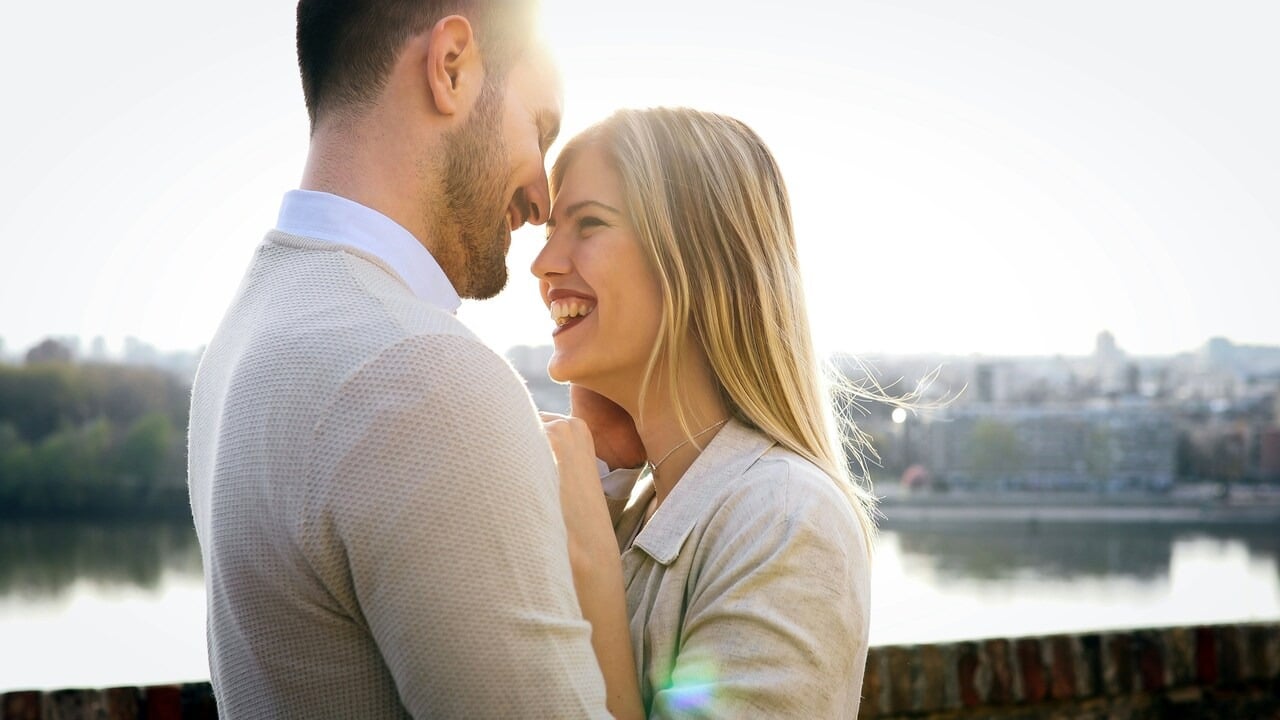 A couple smiling at each other