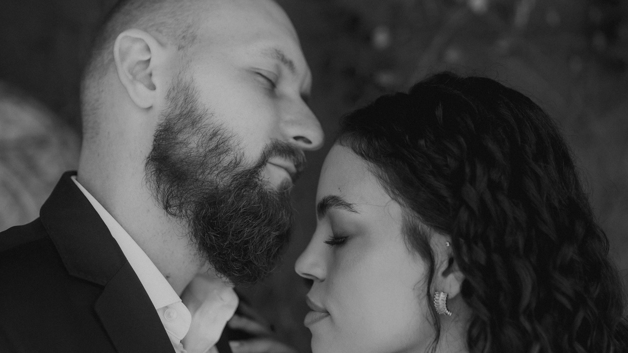 A man and a woman standing next to each other.