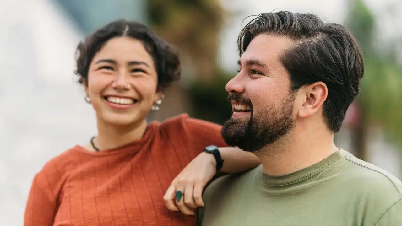 A couple laughing together.