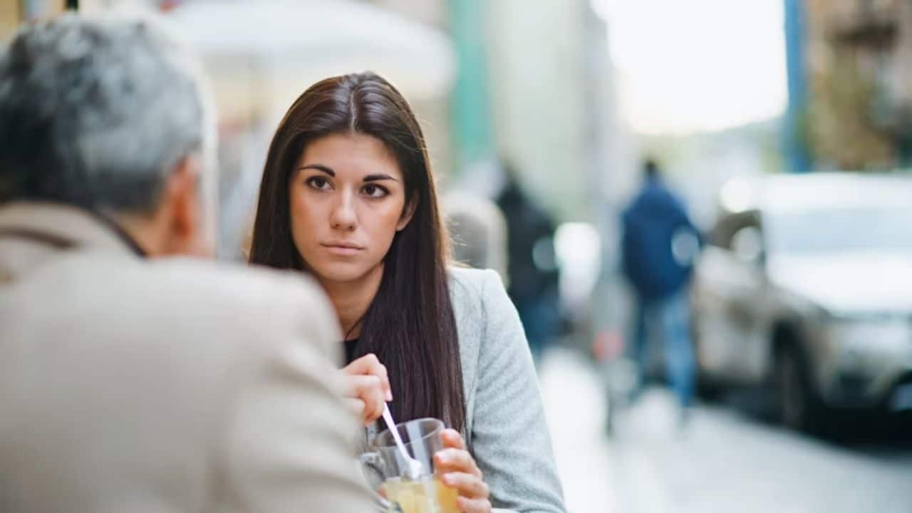 Woman choosing silence during a discussion to avoid conflict