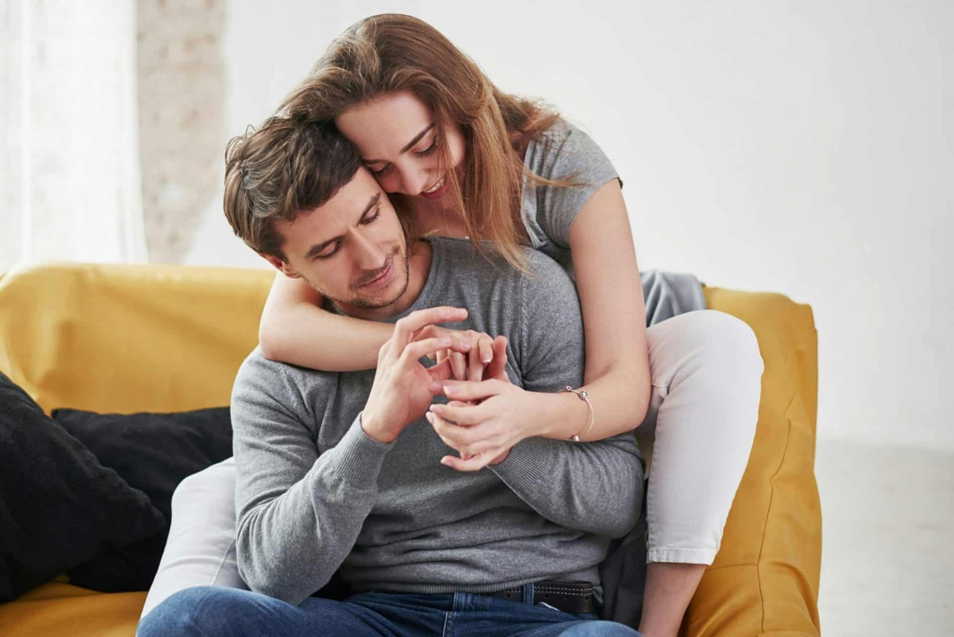 A woman hugging a man