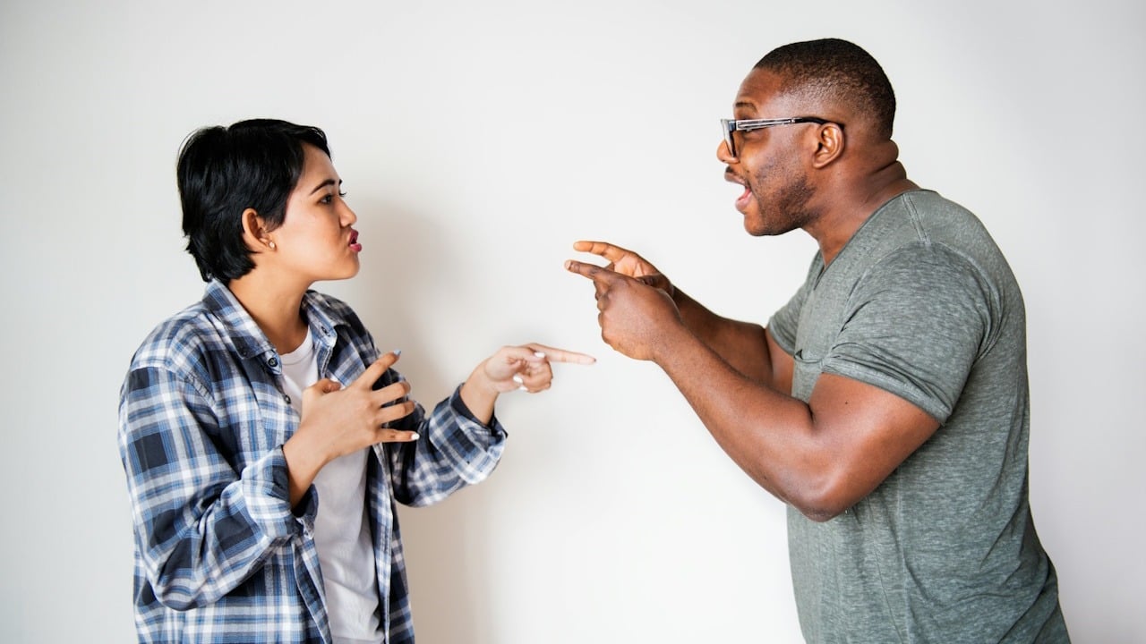 A man and a woman are arguing with each other.