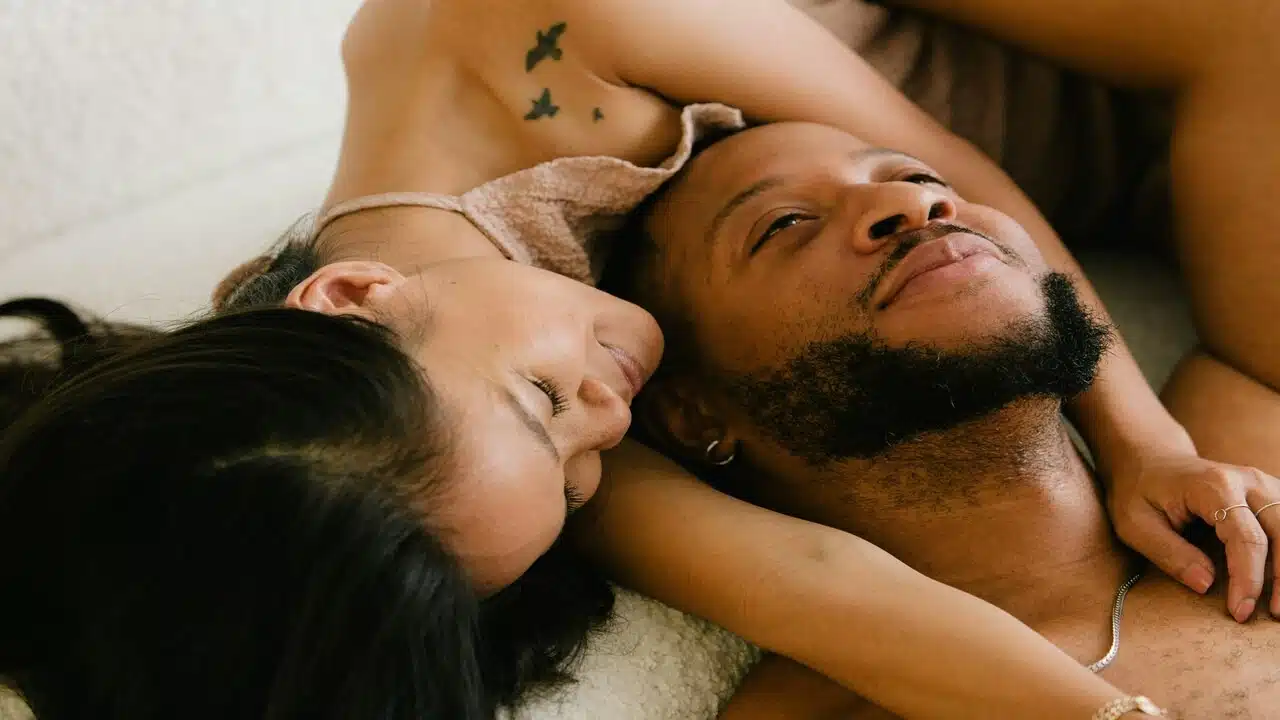 A couple laying in bed together