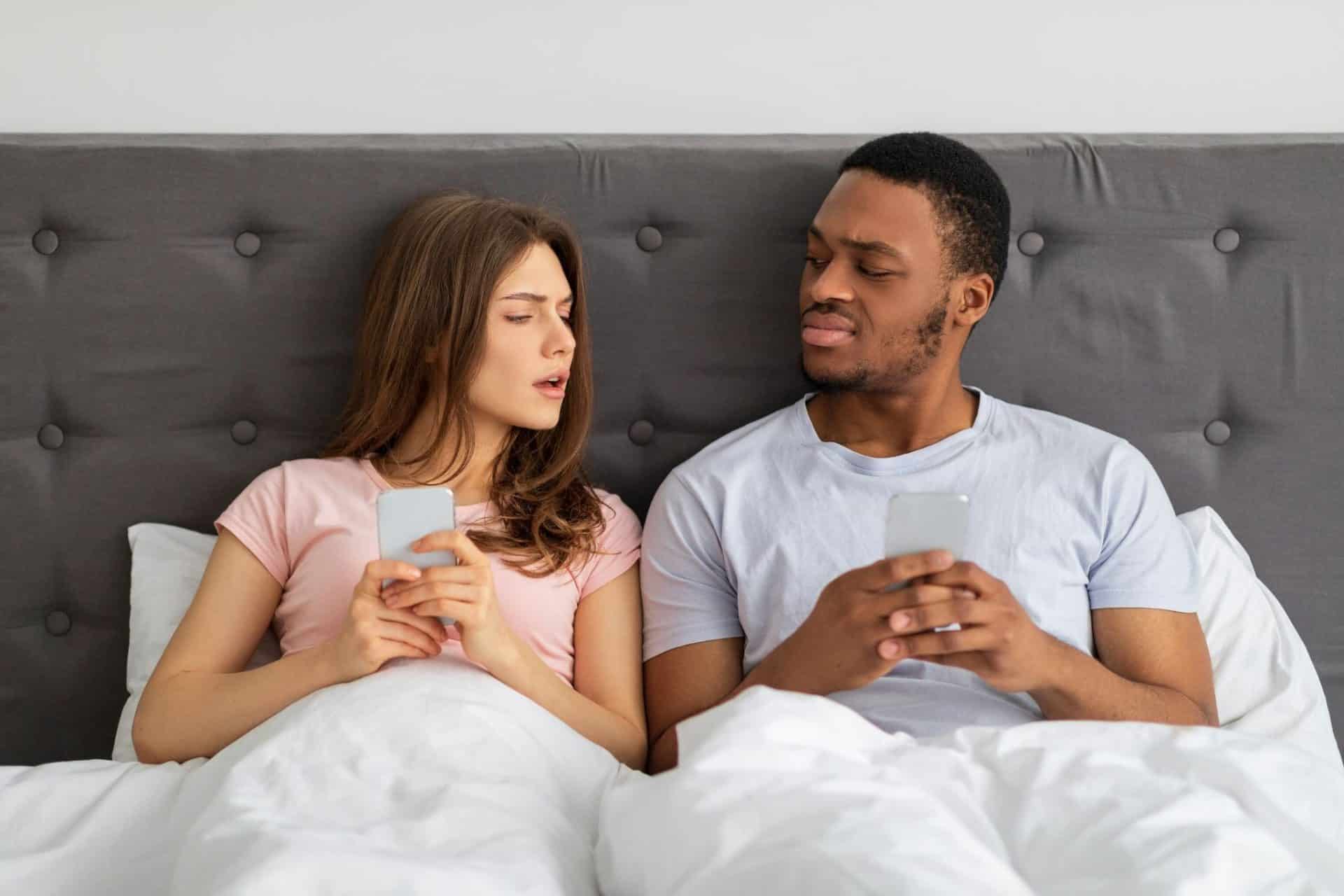 A man and woman using a phone