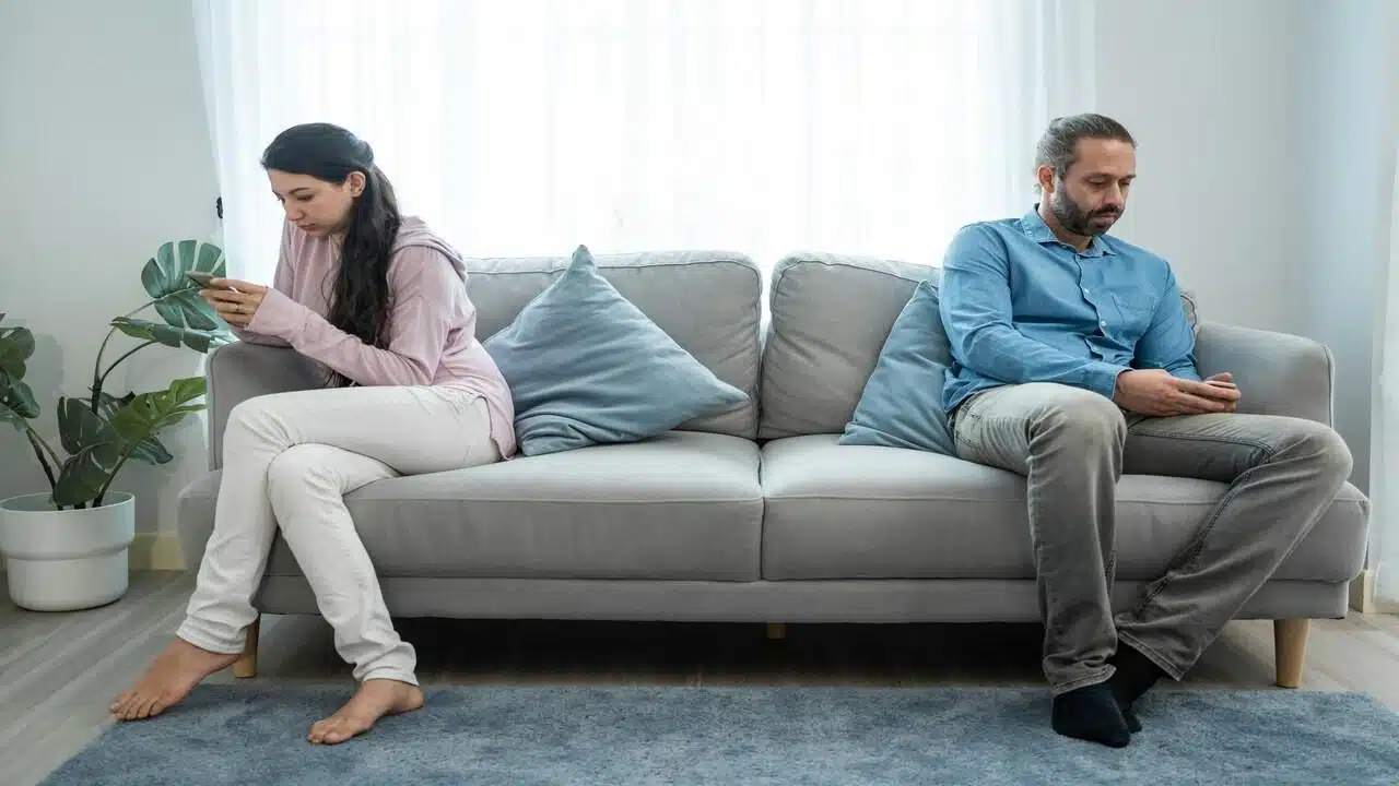 A couple busy with their phones