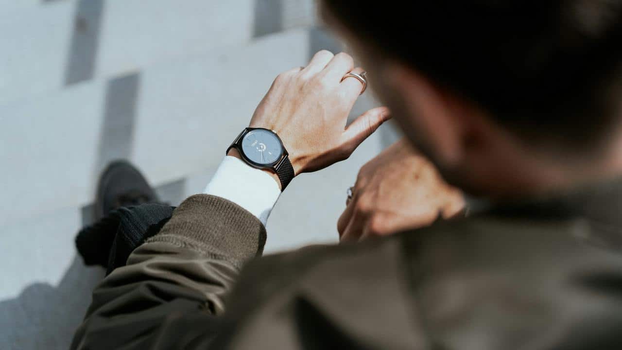 A person checking their wristwatch.