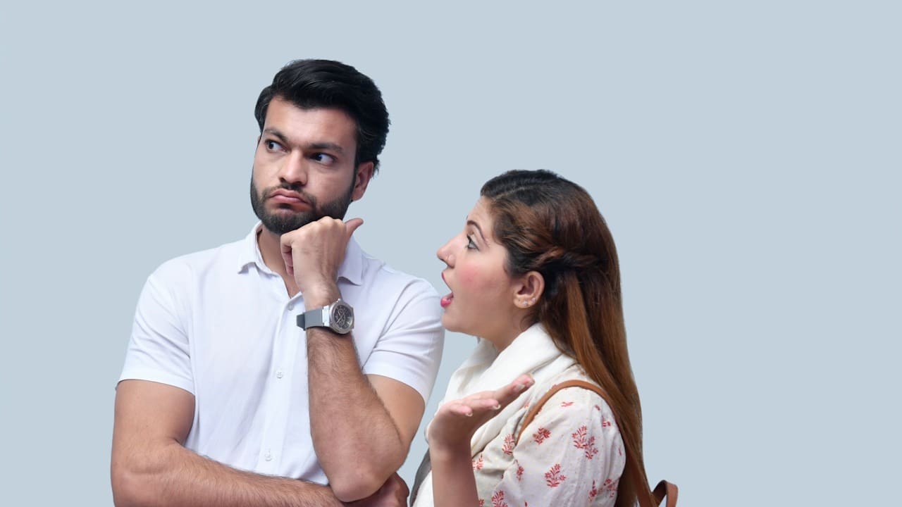A woman nagging a bearded man.