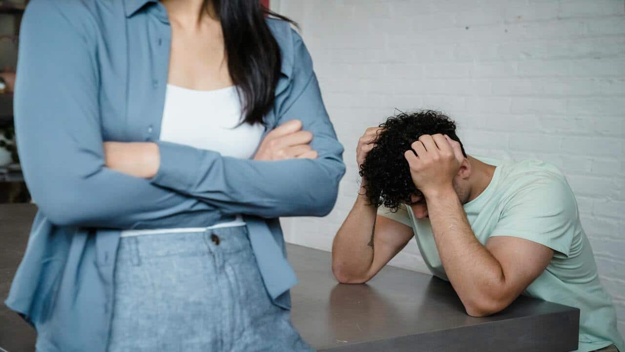 A couple fighting in the dining room
