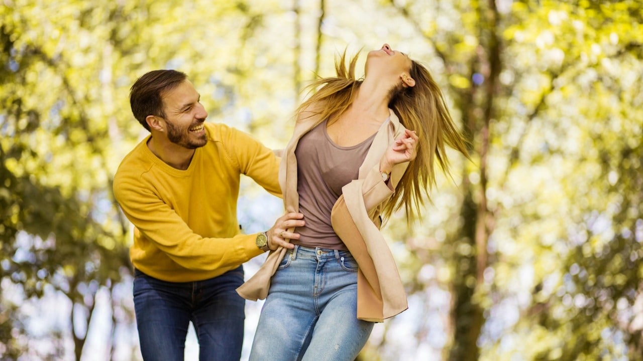 A couple laughing together.