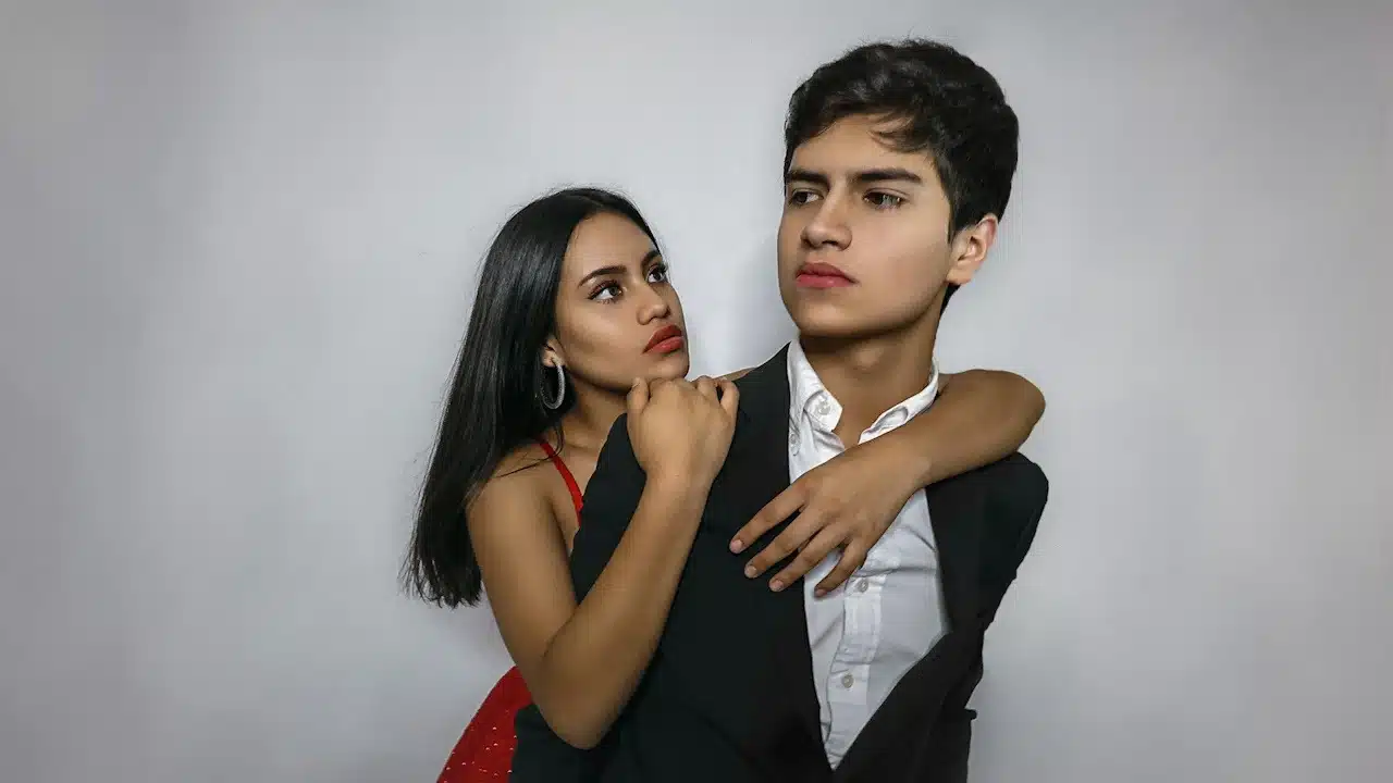 A man and a woman hugging each other.