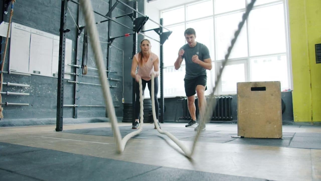 Couple exercising together at a gym
