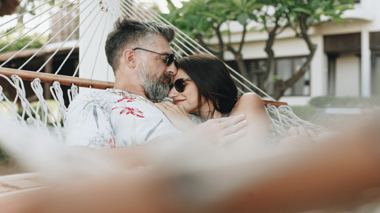 A couple relaxing on a hammock