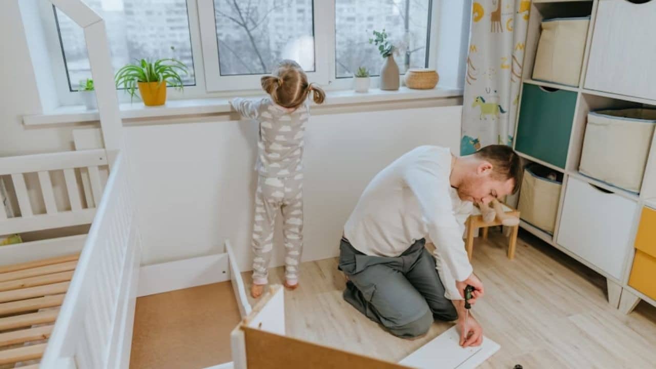 Man repairing something in the bedroom