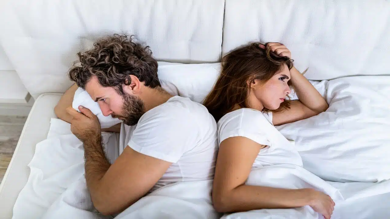 A couple fighting in the bedroom