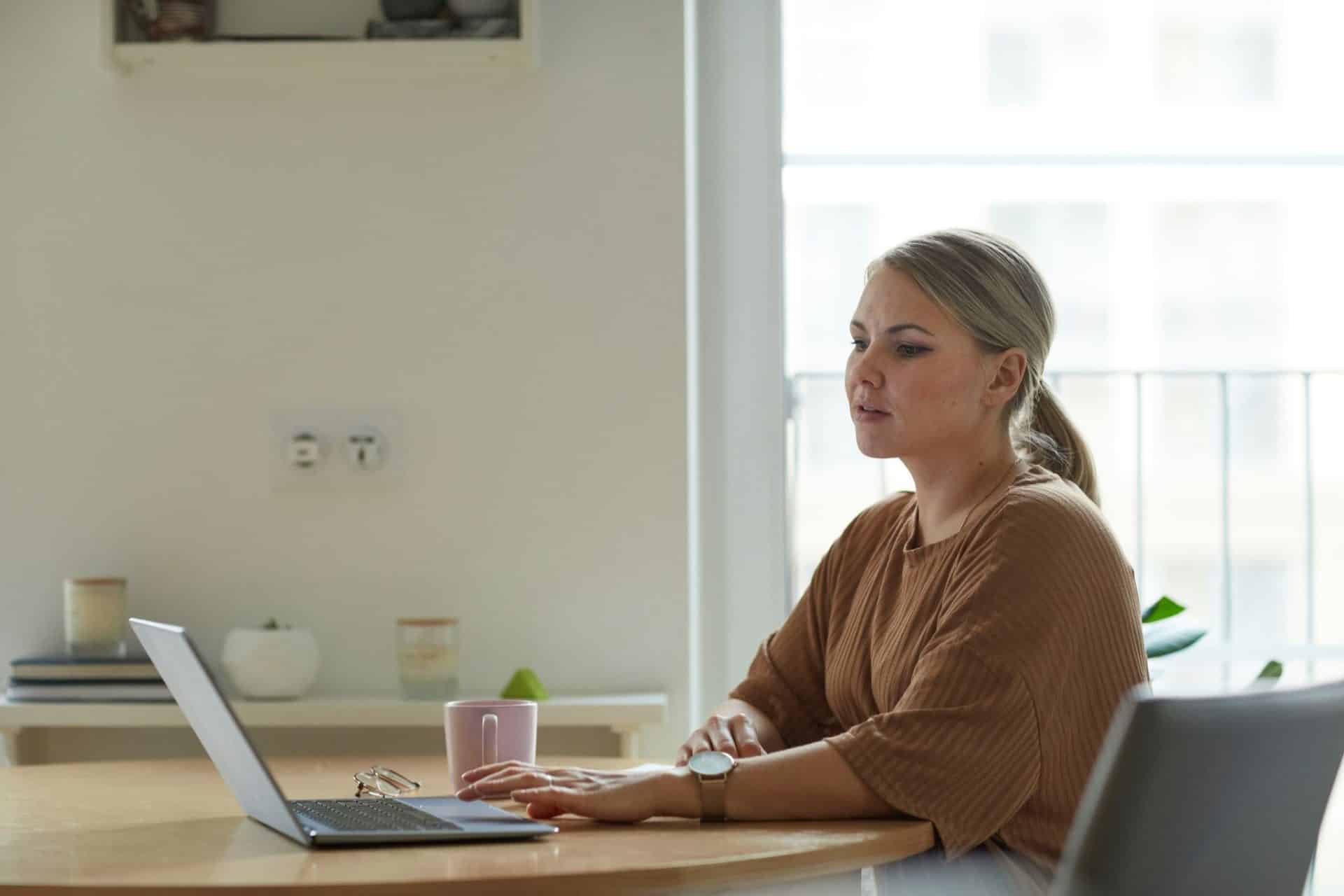 A woman busy with her laptop.