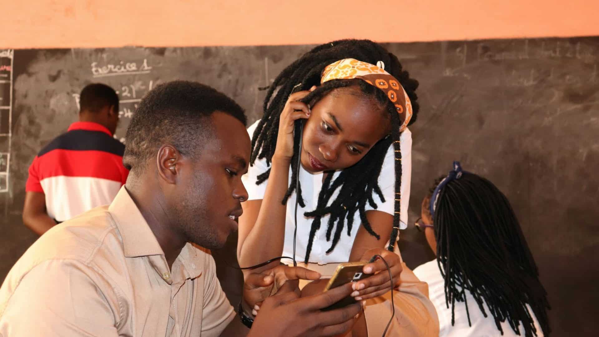 A man showing something to woman