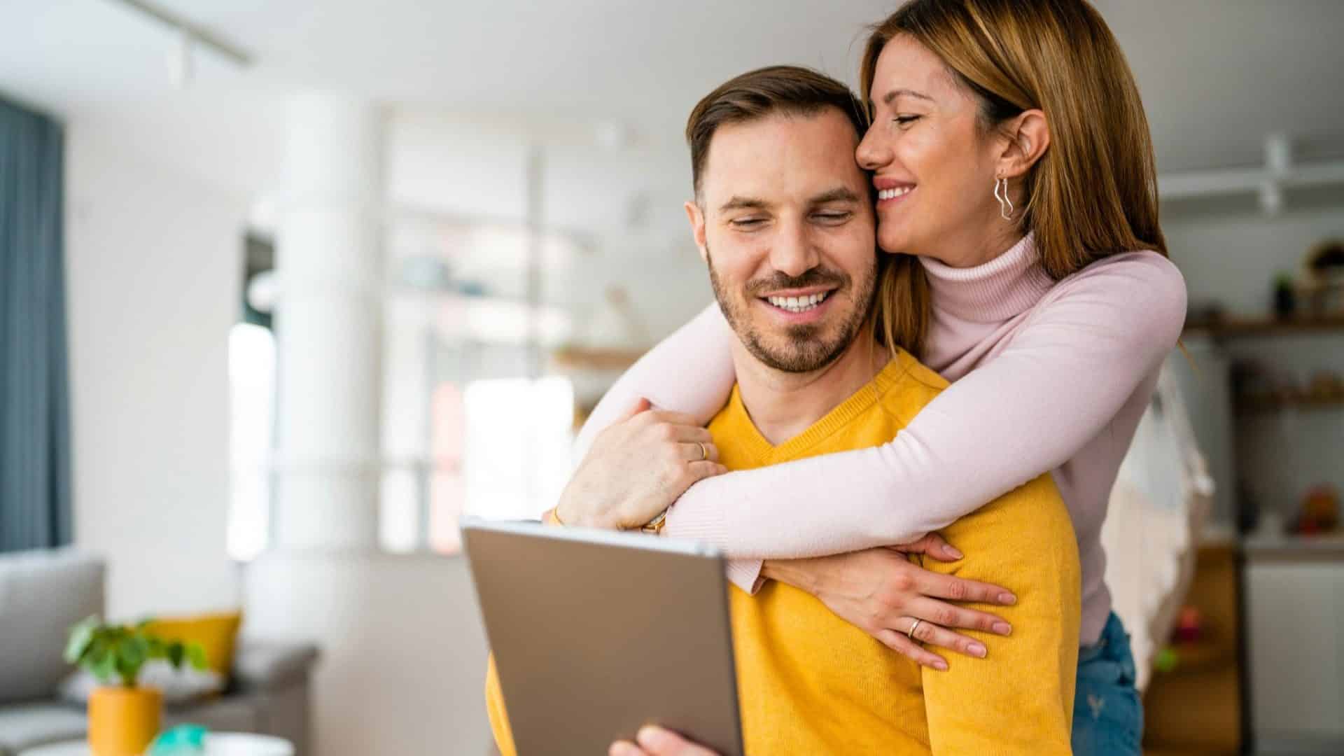 A man hugging a woman
