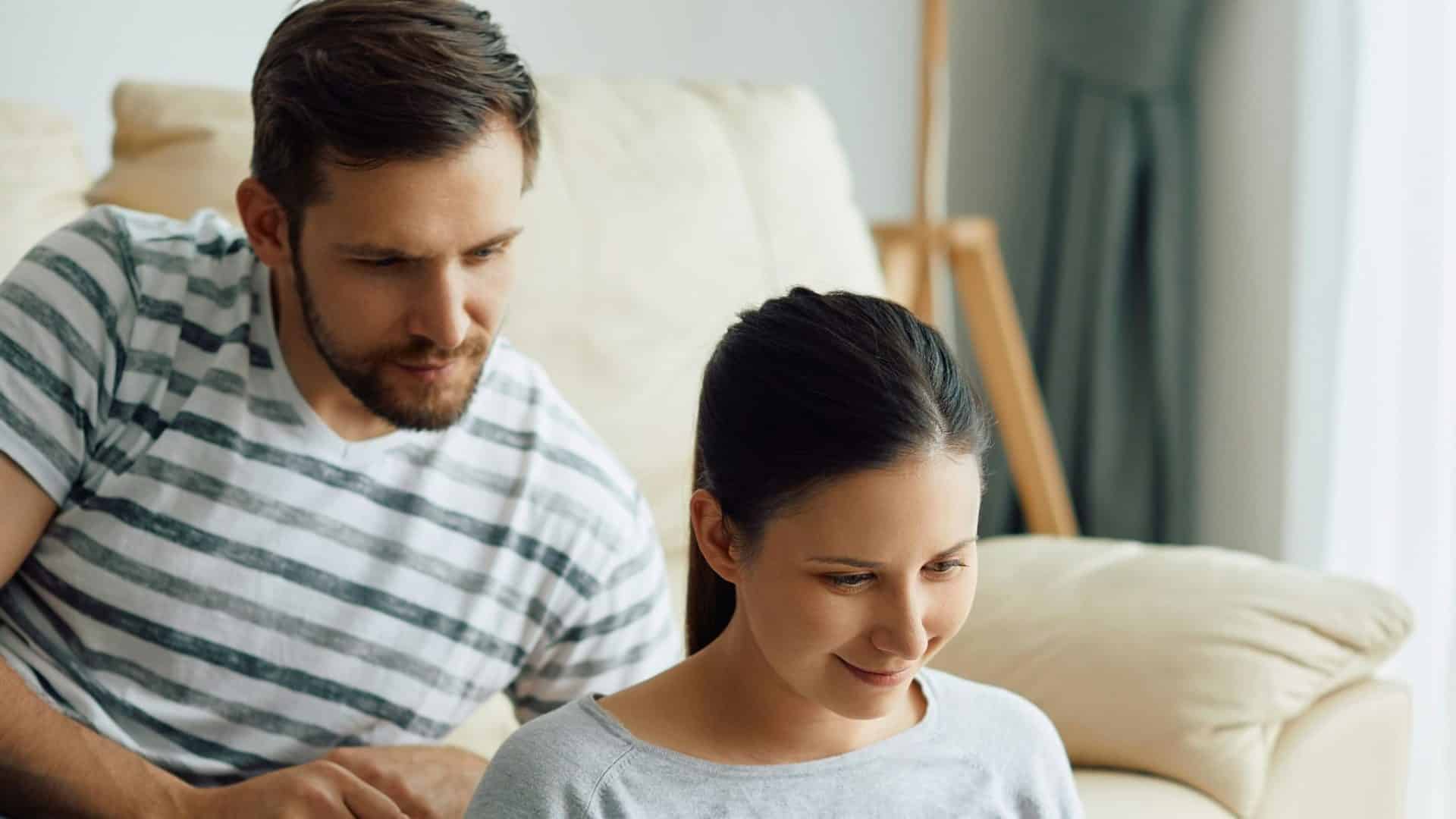 A man supervising a woman