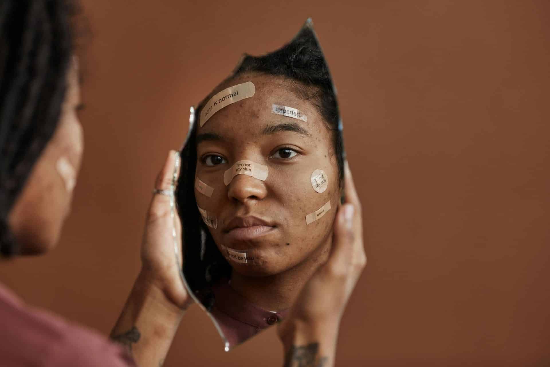 A woman looking at her reflection.