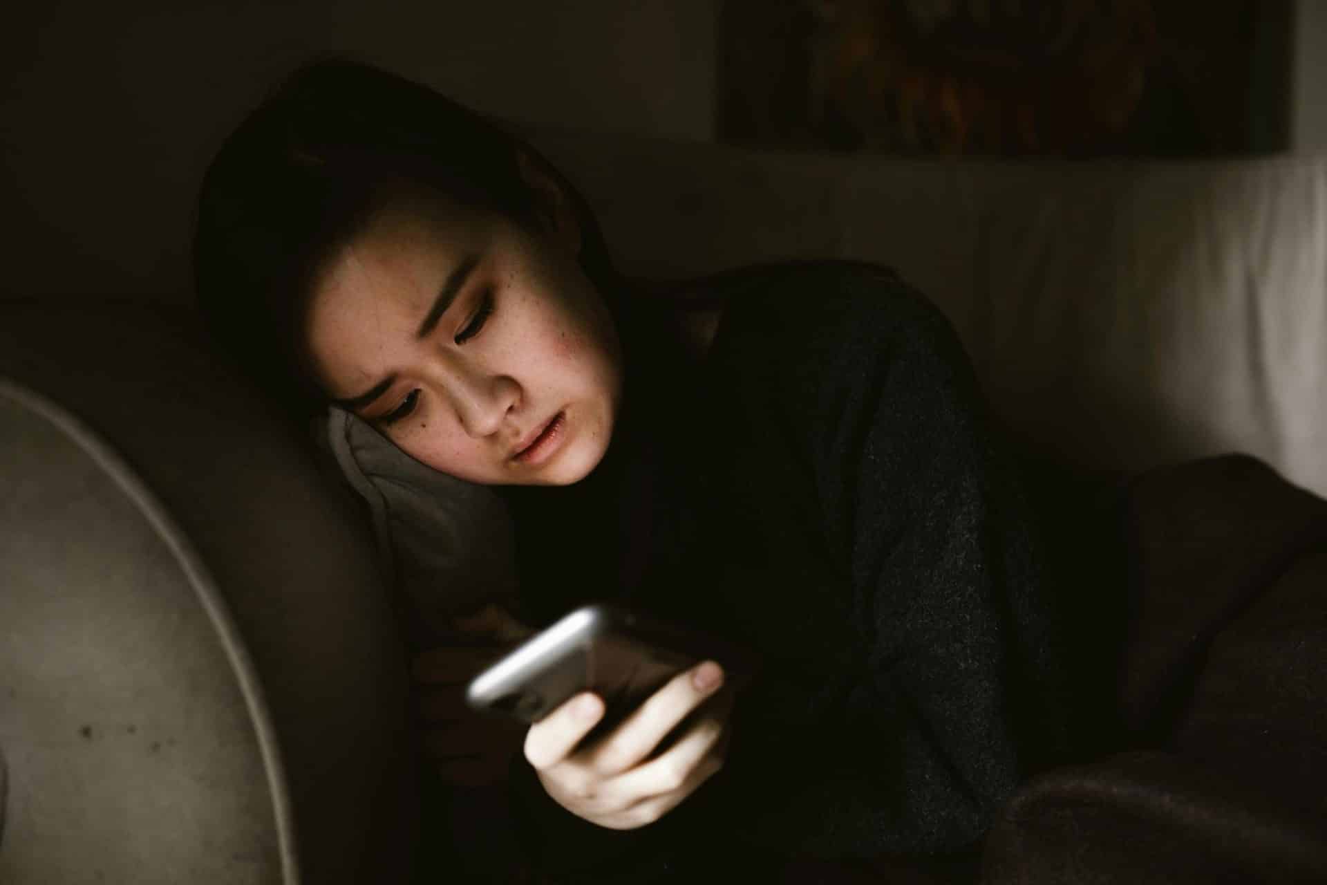 A woman using her phone.