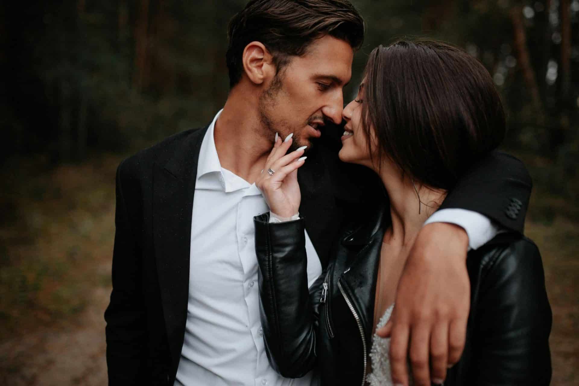 A man holding his arm around a woman.