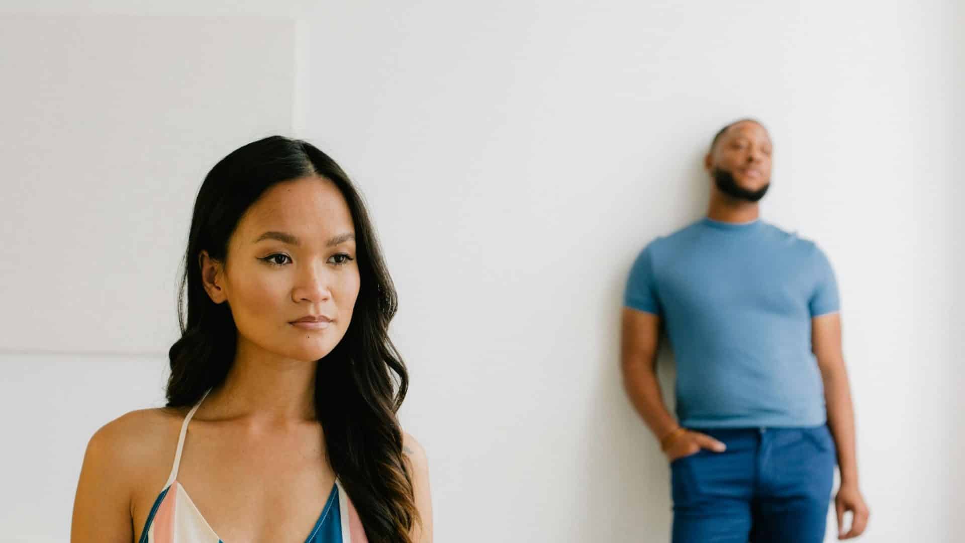 A man and woman having a space between each other