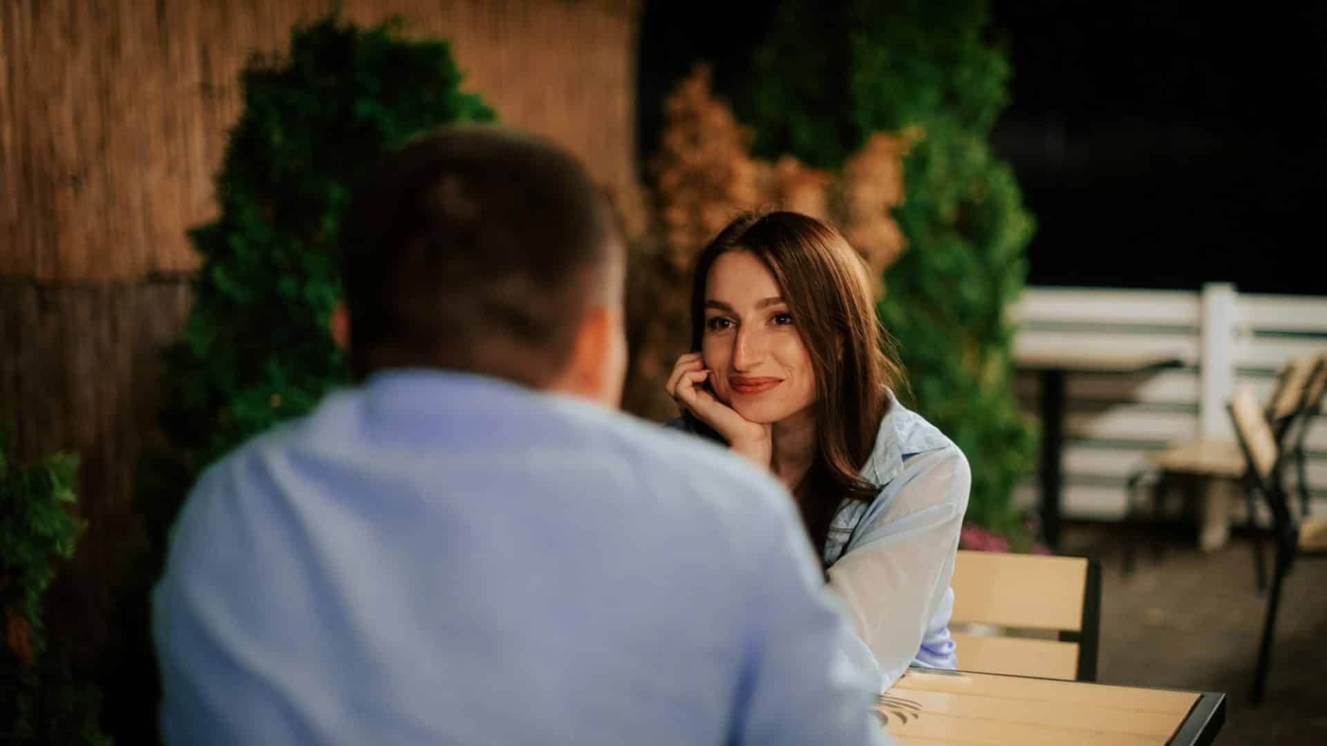 Woman smiling to a man