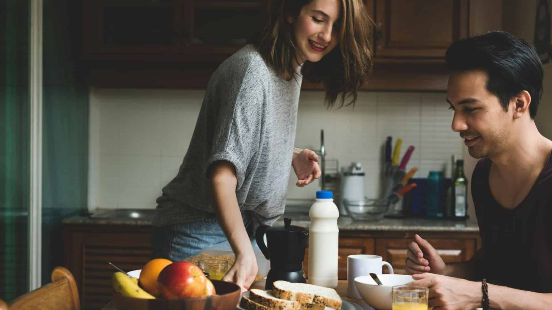 Woman serving a food for a man