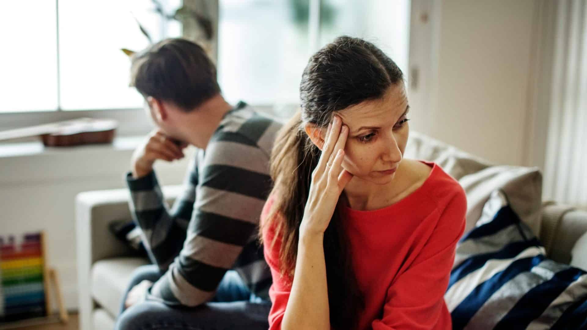 Woman sulking and a man ignoring her