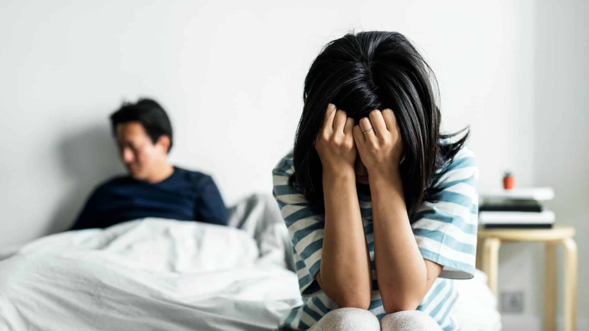 Sad woman and a man ignoring her