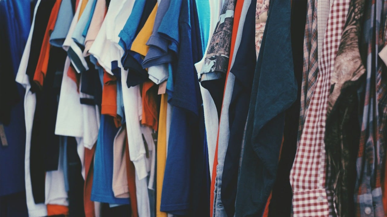 A row of shirts hanging.