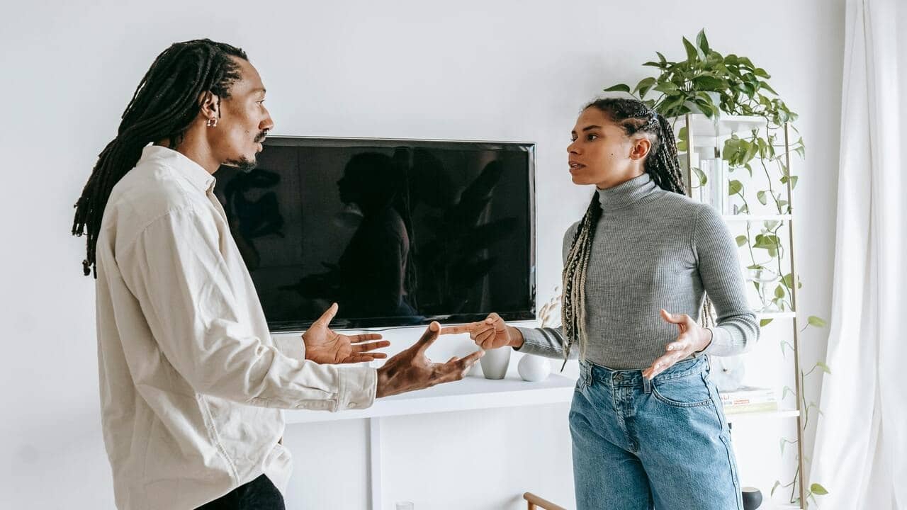 A couple having a serious talk at home