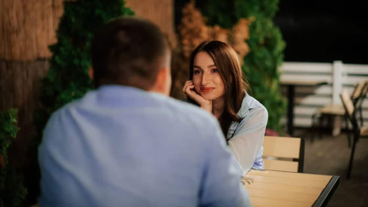 A woman attentively listening to her partner during a conversation