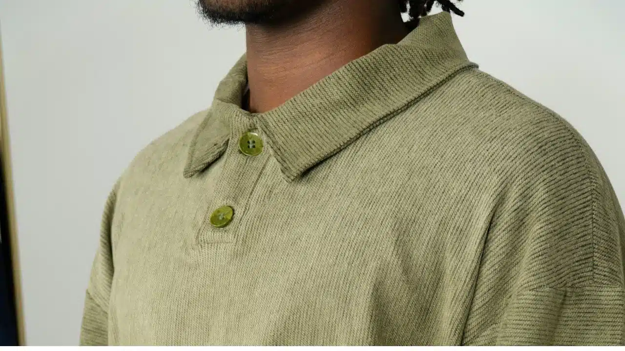 A man wearing a shirt with an untidy collar.