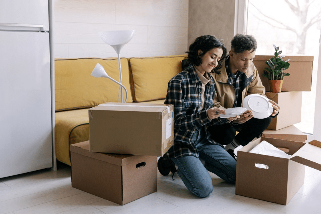 A woman unboxes a dinner set she liked at the shop and received as a gift.