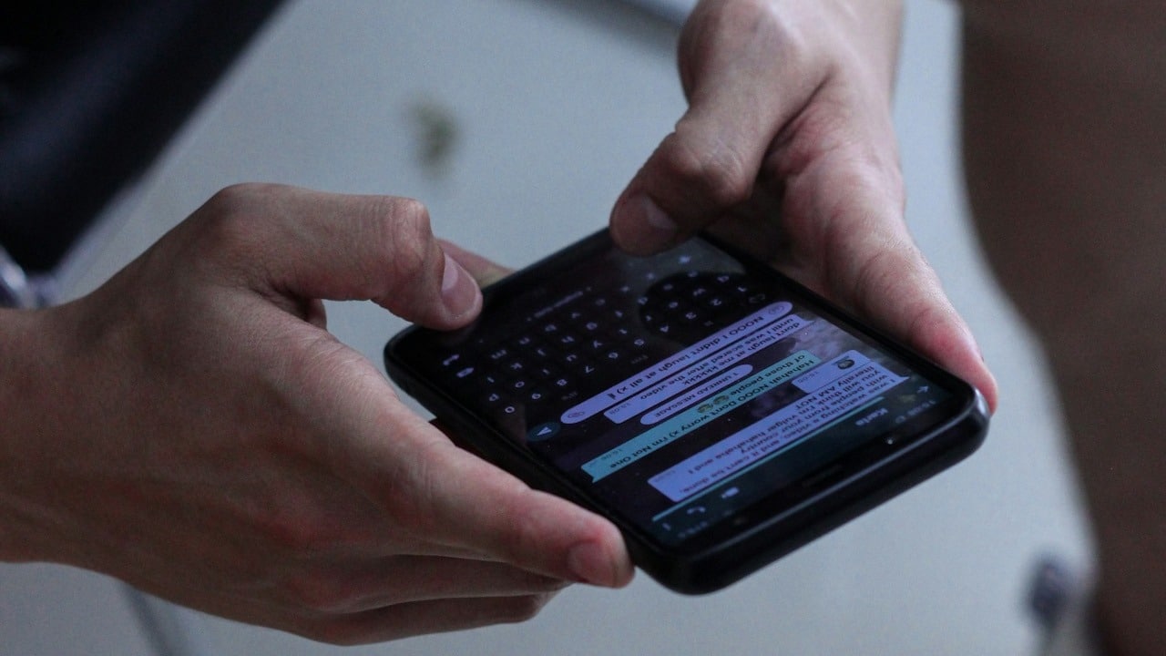 A man texting on his phone.
