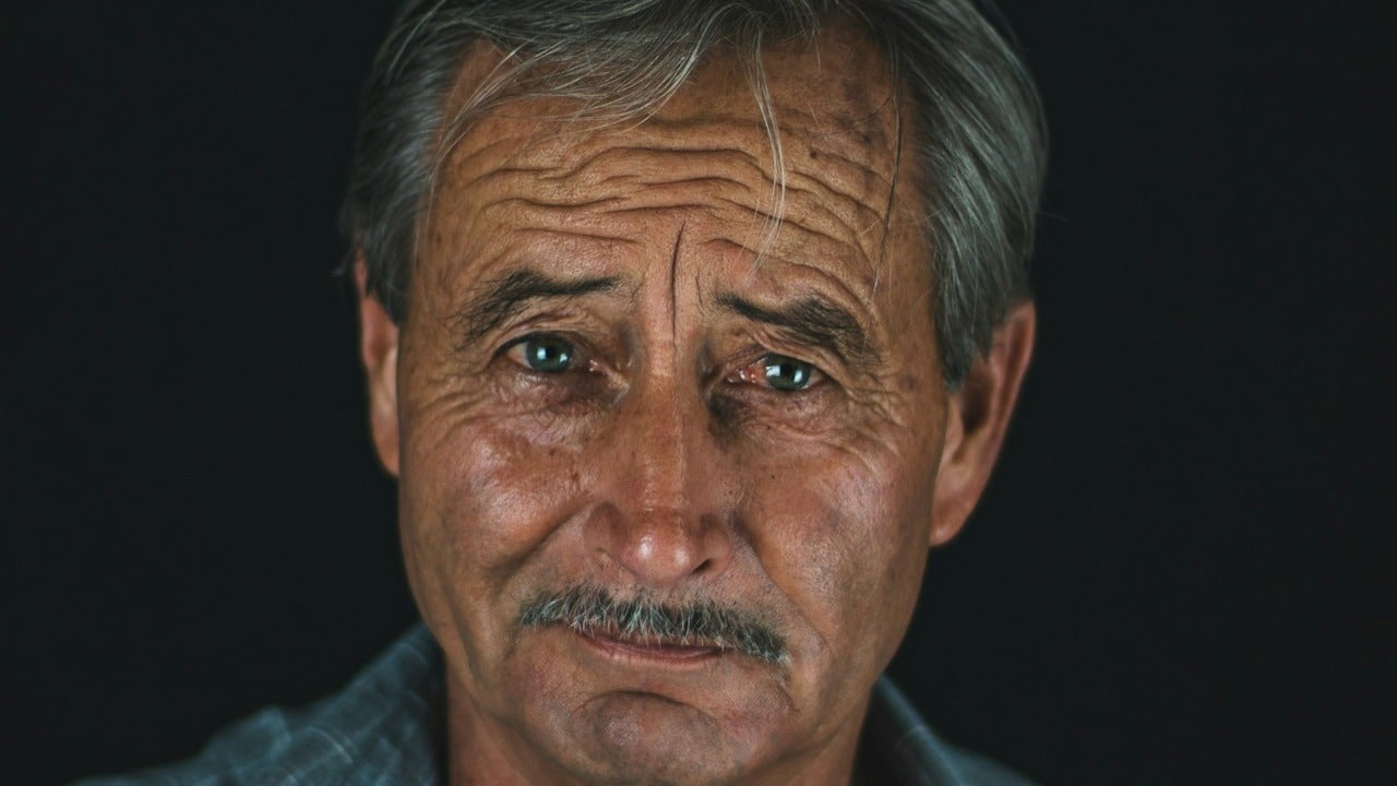 A man looking intensely at the camera.