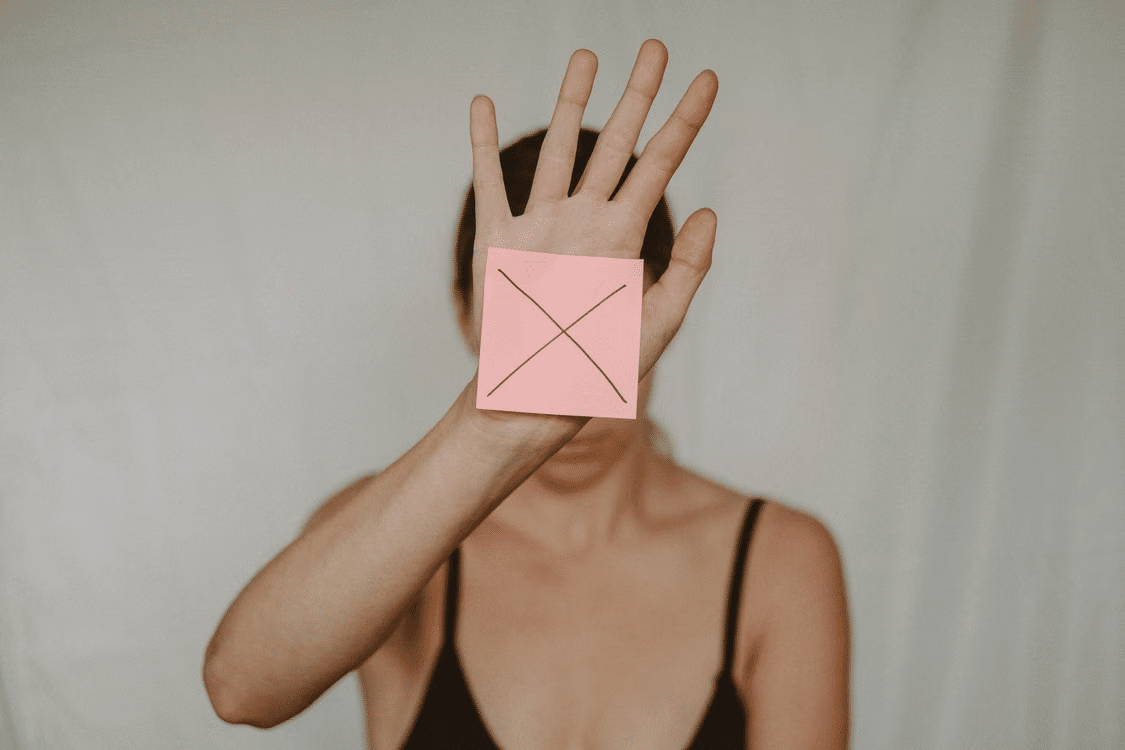 A woman showing no response to an ghosters message.