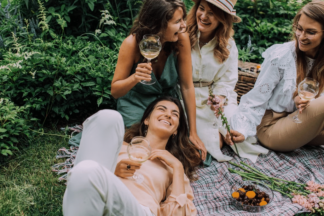 A group of happy girls enjoying a picnic.