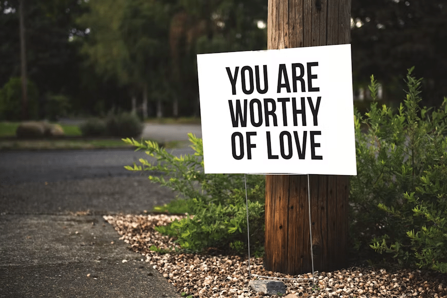 A sign board saying know your worth.