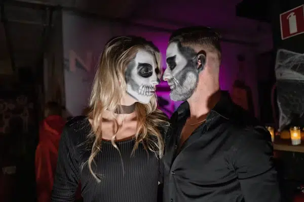 A Halloween couple being flirty.