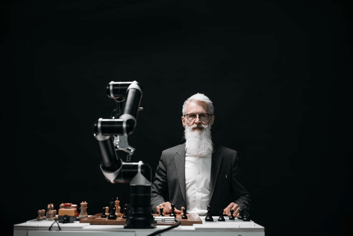 A bearded man playing chess.