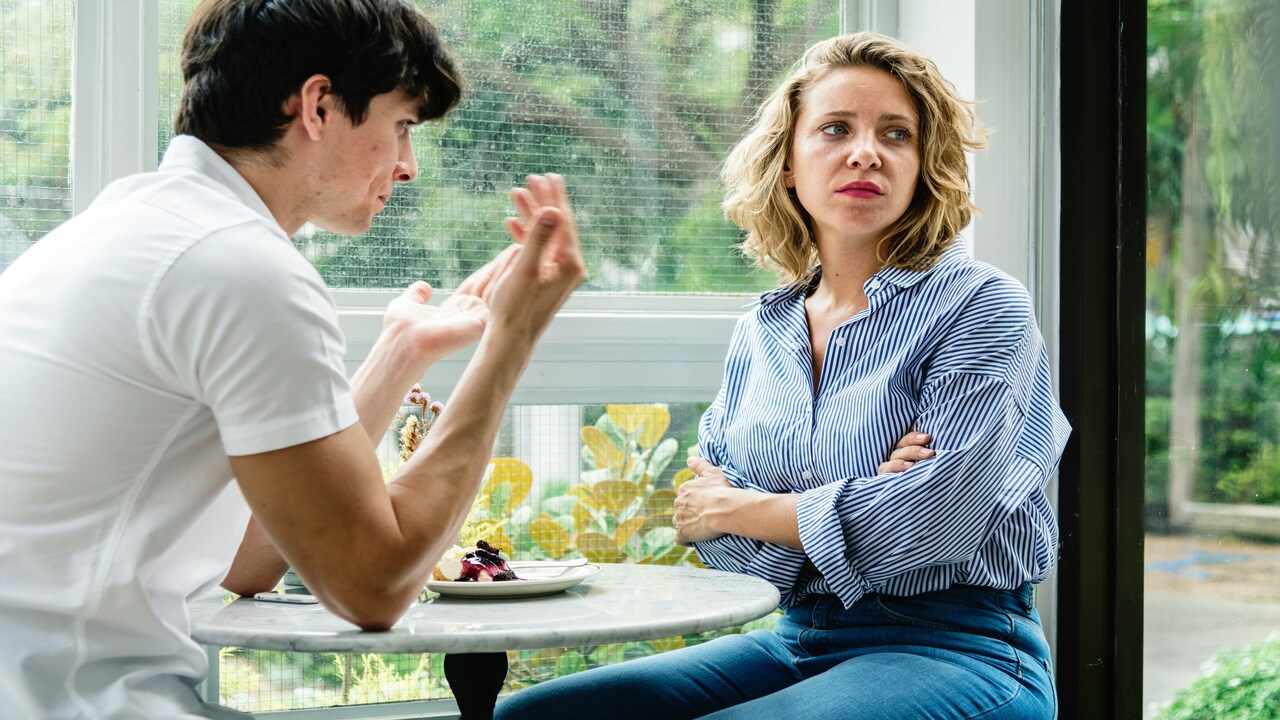 A couple fighting at a cafe